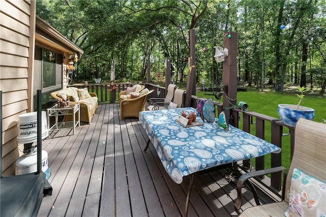 124 Denham Ln, Midway, GA 31320 - wooden terrace with outdoor dining area, an outdoor living space, and a yard