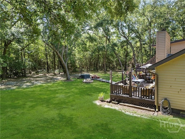 124 Denham Ln, Midway, GA 31320 - view of green lawn with a wooden deck