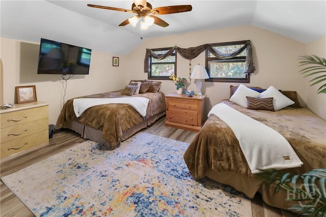 124 Denham Ln, Midway, GA 31320 - bedroom with vaulted ceiling, wood finished floors, and a ceiling fan