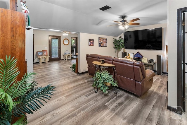 124 Denham Ln, Midway, GA 31320 - living area with ceiling fan, light wood-type flooring, baseboards, and lofted ceiling
