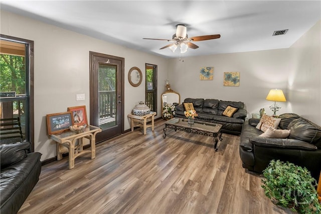 124 Denham Ln, Midway, GA 31320 - living area with ceiling fan, wood finished floors, and baseboards