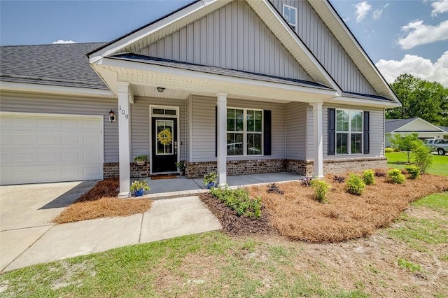 109 Amelia Ct, Guyton, GA 31312 - view of front of property featuring board and batten siding, brick siding, a porch, an attached garage, and concrete driveway