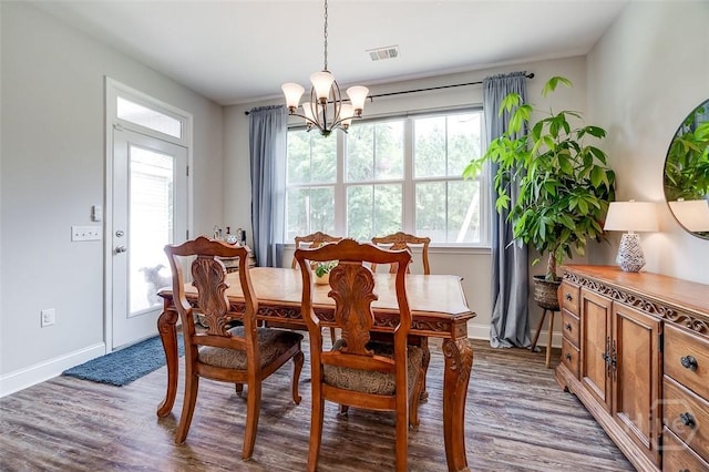 109 Amelia Ct, Guyton, GA 31312 - dining room featuring a chandelier, wood finished floors, and baseboards
