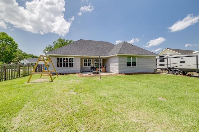 109 Amelia Ct, Guyton, GA 31312 - rear view of house with a patio area, a playground, and a shingled roof