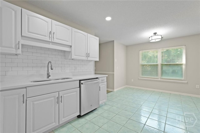 121 Warner Dr, Guyton, GA 31312 - kitchen with dishwasher, a sink, tasteful backsplash, light countertops, and a textured ceiling