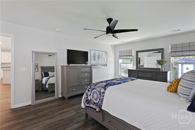 235 Cromer St, Savannah, GA 31407 - bedroom with multiple windows, dark wood-type flooring, baseboards, and a ceiling fan