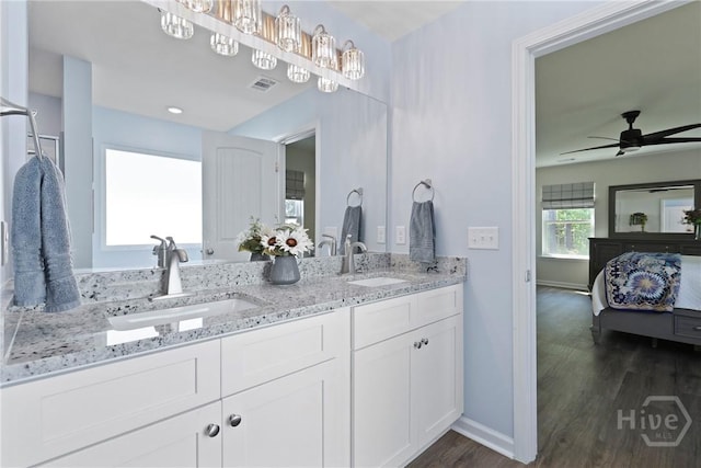 235 Cromer St, Savannah, GA 31407 - ensuite bathroom with double vanity, wood finished floors, ceiling fan, and baseboards