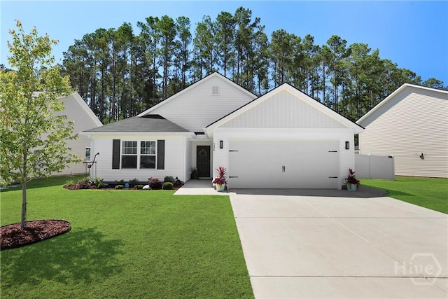 235 Cromer St, Savannah, GA 31407 - view of front of property with a garage, a front yard, concrete driveway, and board and batten siding