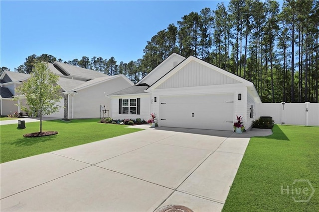 235 Cromer St, Savannah, GA 31407 - view of front of house featuring a garage, driveway, board and batten siding, and a gate