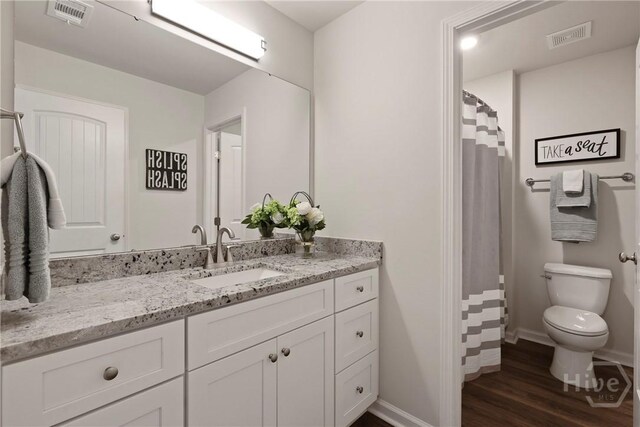 235 Cromer St, Savannah, GA 31407 - bathroom with toilet, vanity, wood finished floors, baseboards, and a shower with curtain
