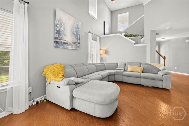 46 Central Park Way, Savannah, GA 31407 - living area featuring stairway, wood finished floors, healthy amount of natural light, and a high ceiling