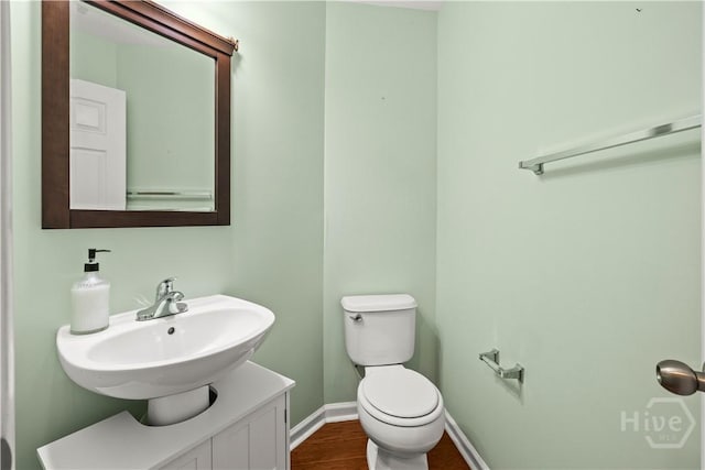 46 Central Park Way, Savannah, GA 31407 - bathroom with a sink, toilet, baseboards, and wood finished floors