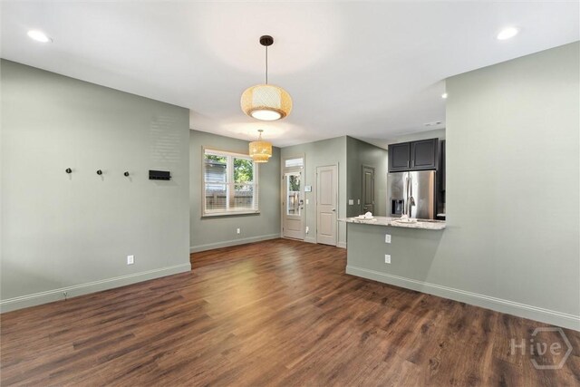 2142 New York Ave, Savannah, GA 31404 - unfurnished living room with baseboards, dark wood-style flooring, and recessed lighting
