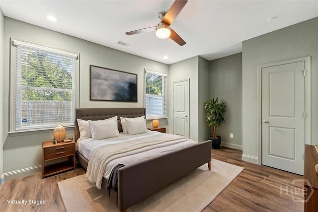 2142 New York Ave, Savannah, GA 31404 - bedroom featuring baseboards, wood finished floors, and a ceiling fan
