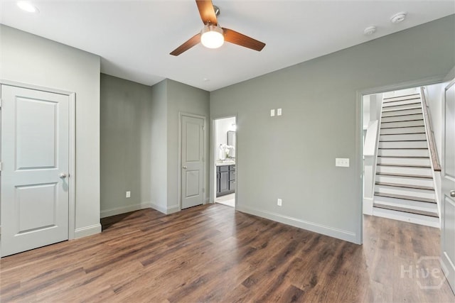 2142 New York Ave, Savannah, GA 31404 - unfurnished bedroom with wood finished floors, baseboards, ensuite bathroom, and a ceiling fan