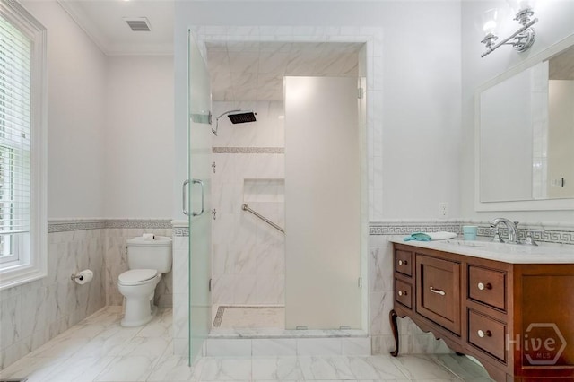 36 Belted Kingfisher Ln, Richmond Hill, GA 31324 - full bath with tile walls, vanity, toilet, a stall shower, and a wainscoted wall