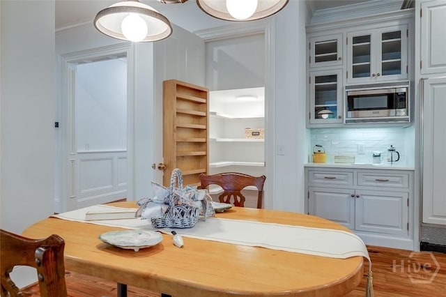 36 Belted Kingfisher Ln, Richmond Hill, GA 31324 - dining room featuring ornamental molding and wood finished floors