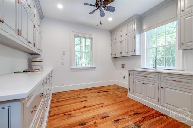 36 Belted Kingfisher Ln, Richmond Hill, GA 31324 - washroom featuring cabinet space, washer hookup, a ceiling fan, baseboards, and recessed lighting