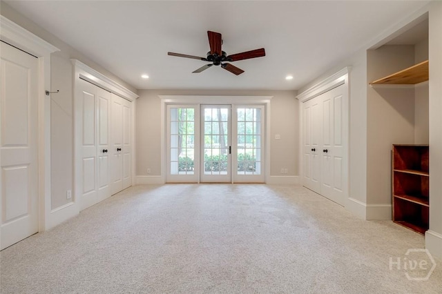 36 Belted Kingfisher Ln, Richmond Hill, GA 31324 - unfurnished bedroom with carpet flooring, recessed lighting, access to outside, baseboards, and two closets