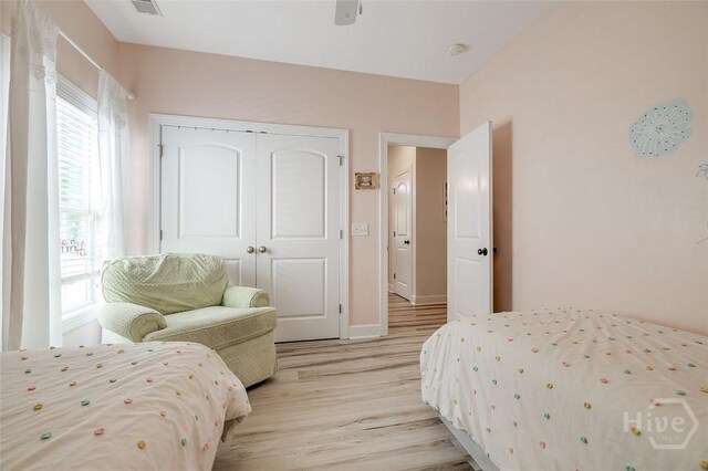 2 Iron Gate Ct, Pooler, GA 31322 - bedroom with light wood-style flooring, a closet, baseboards, and ceiling fan
