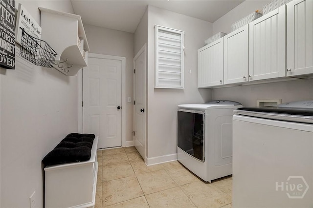 2 Iron Gate Ct, Pooler, GA 31322 - laundry area with separate washer and dryer, cabinet space, light tile patterned floors, and baseboards