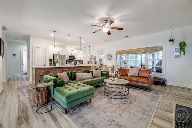 2 Iron Gate Ct, Pooler, GA 31322 - living area with light wood-style floors, a ceiling fan, and baseboards