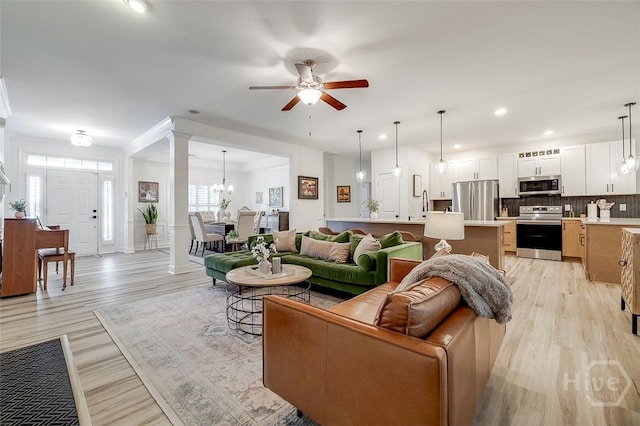 2 Iron Gate Ct, Pooler, GA 31322 - living area with light wood-type flooring, ceiling fan, recessed lighting, a chandelier, and baseboards
