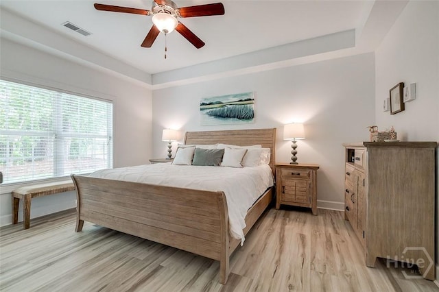 2 Iron Gate Ct, Pooler, GA 31322 - bedroom with light wood-type flooring, baseboards, a ceiling fan, and a raised ceiling