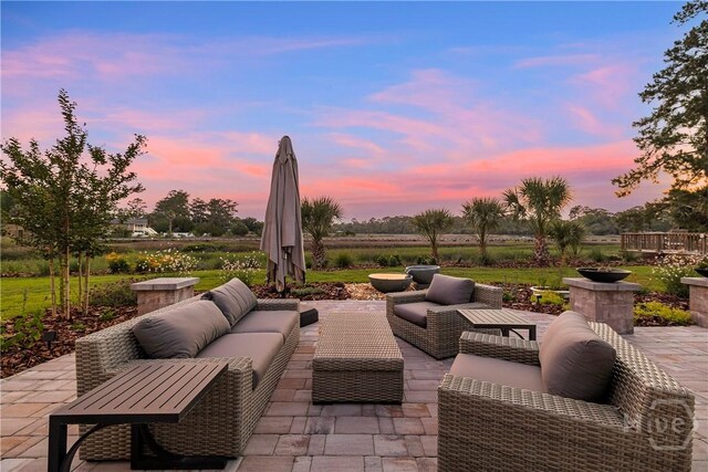 907 Cheryl St, Savannah, GA 31410 - patio terrace at dusk featuring a patio area and an outdoor hangout area