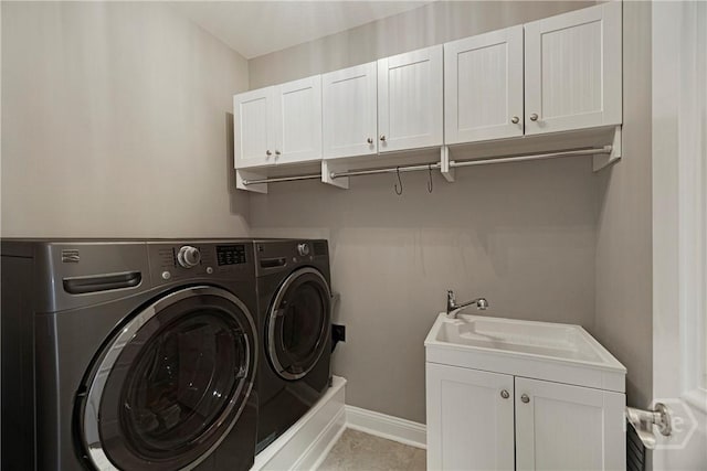 907 Cheryl St, Savannah, GA 31410 - washroom featuring separate washer and dryer, cabinet space, and baseboards
