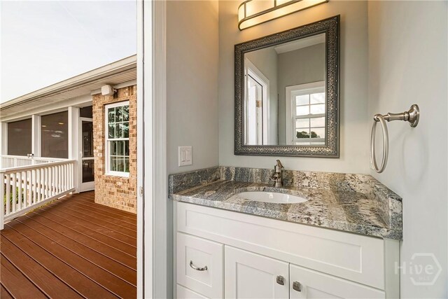 907 Cheryl St, Savannah, GA 31410 - bathroom with vanity, wood finished floors, and healthy amount of natural light