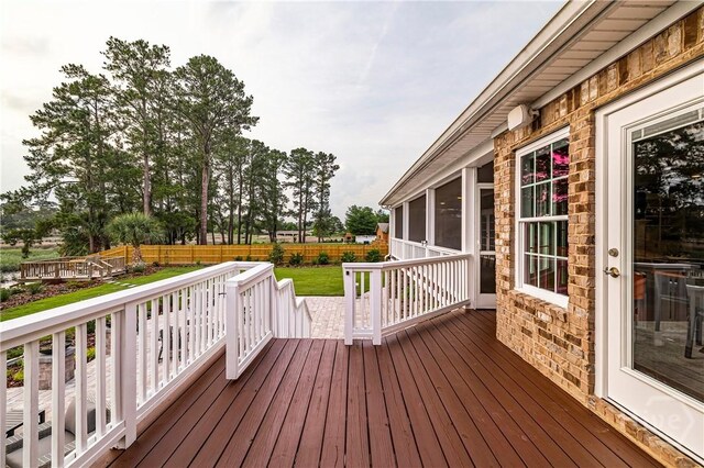 907 Cheryl St, Savannah, GA 31410 - wooden deck featuring a sunroom