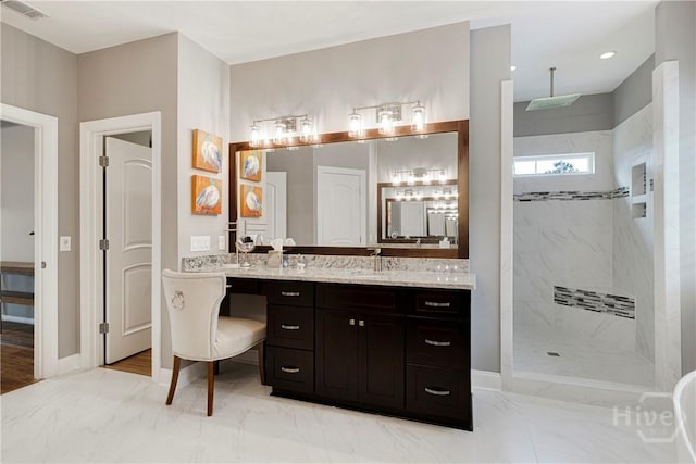 907 Cheryl St, Savannah, GA 31410 - bathroom featuring a marble finish shower, vanity, and baseboards