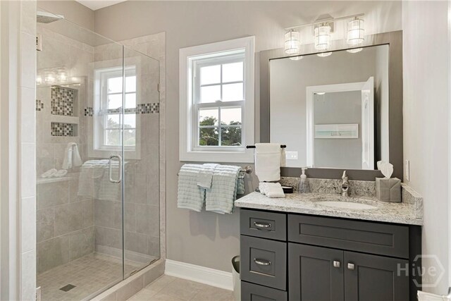 907 Cheryl St, Savannah, GA 31410 - bathroom with a shower stall, vanity, baseboards, and tile patterned flooring
