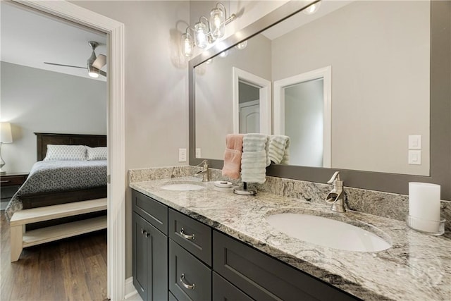 907 Cheryl St, Savannah, GA 31410 - ensuite bathroom featuring double vanity, a ceiling fan, and wood finished floors