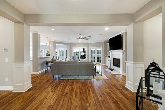 907 Cheryl St, Savannah, GA 31410 - living area with dark wood-style flooring, a fireplace, baseboards, a ceiling fan, and recessed lighting