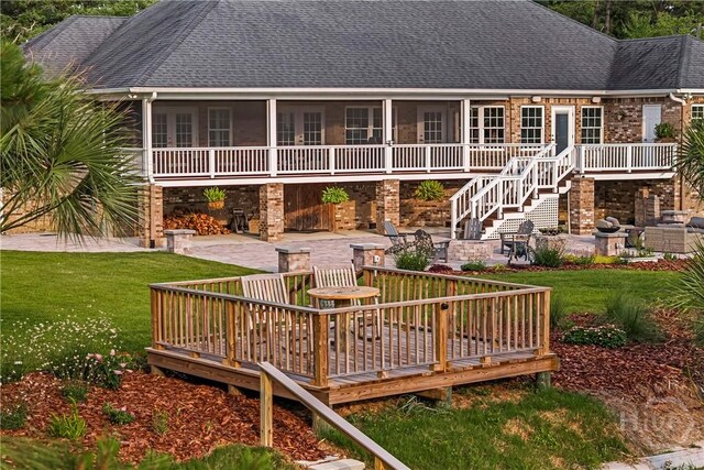 907 Cheryl St, Savannah, GA 31410 - rear view of house featuring a wooden deck, a patio, and a shingled roof