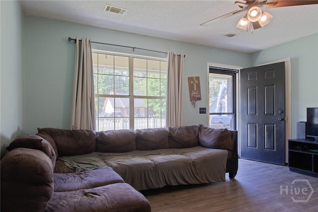 128 Deann Dr, Hinesville, GA 31313 - living area featuring a ceiling fan, wood finished floors, and a textured ceiling