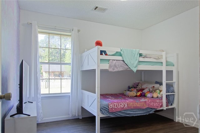 128 Deann Dr, Hinesville, GA 31313 - bedroom featuring wood finished floors and a textured ceiling