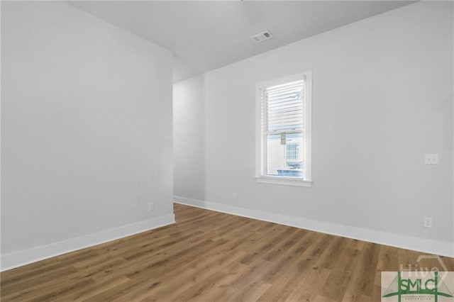 826 W Victory Dr, Savannah, GA 31405 - empty room with wood finished floors and baseboards