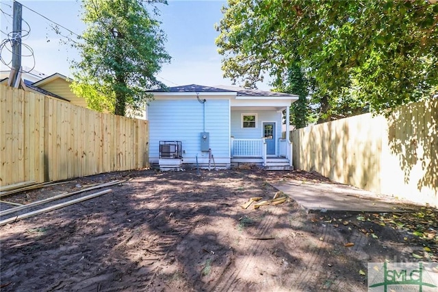 826 W Victory Dr, Savannah, GA 31405 - rear view of house featuring a fenced backyard and covered porch