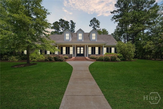 104 Post House Trl, Pooler, GA 31322 - new england style home with a front yard and french doors