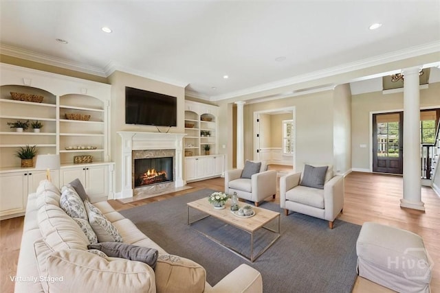 104 Post House Trl, Pooler, GA 31322 - living area featuring decorative columns, crown molding, light wood-type flooring, a fireplace, and recessed lighting