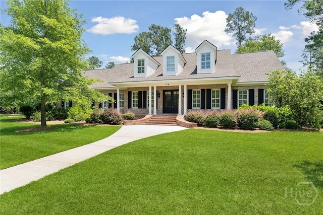 104 Post House Trl, Pooler, GA 31322 - new england style home featuring french doors, a front lawn, and a shingled roof