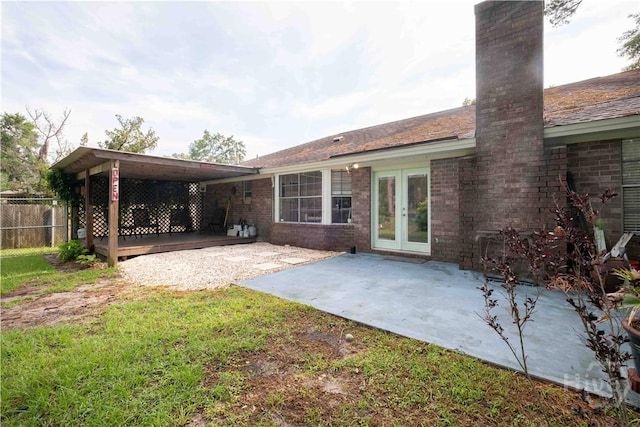 3 Black Forest Dr, Savannah, GA 31410 - back of property with a chimney, a patio, brick siding, and french doors