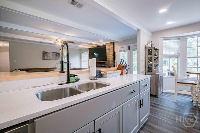 3 Black Forest Dr, Savannah, GA 31410 - kitchen featuring a sink, open floor plan, beamed ceiling, recessed lighting, and dark wood-type flooring