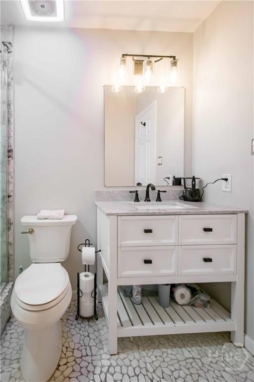 3 Black Forest Dr, Savannah, GA 31410 - bathroom featuring vanity, a shower stall, toilet, and baseboards