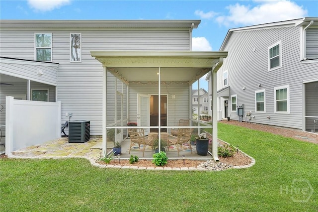 142 Benelli Dr, Pooler, GA 31322 - rear view of house featuring central AC, a sunroom, and a lawn