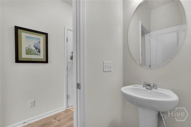 142 Benelli Dr, Pooler, GA 31322 - bathroom featuring wood finished floors, a sink, and baseboards