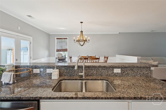 43 Godley Park Way, Savannah, GA 31407 - kitchen featuring a sink, dark stone countertops, a chandelier, and crown molding